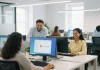 Small business team using Microsoft Office 2021 on laptops and desktops in a modern office.